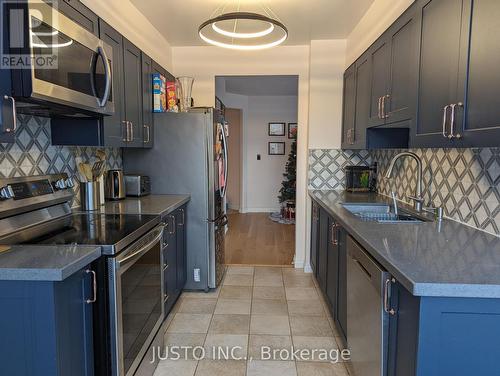 105 - 480 Mclevin Avenue, Toronto, ON - Indoor Photo Showing Kitchen With Double Sink