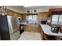 4894 Kemmi Crescent, 108 Mile Ranch, BC  - Indoor Photo Showing Kitchen With Double Sink 