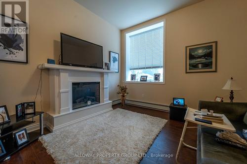 65 6Th Avenue, Englehart, ON - Indoor Photo Showing Living Room With Fireplace