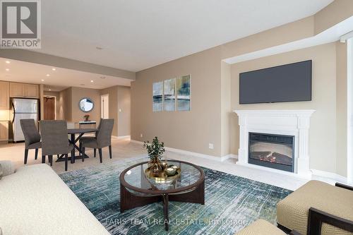 907 - 33 Ellen Street, Barrie, ON - Indoor Photo Showing Living Room With Fireplace