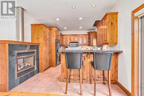 26 Trails End, Collingwood, ON - Indoor Photo Showing Kitchen With Fireplace