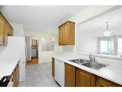 201-1385 Bertram Street, Kelowna, BC - Indoor Photo Showing Kitchen With Double Sink