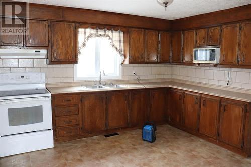 8 West Street, Stephenville, NL - Indoor Photo Showing Kitchen With Double Sink