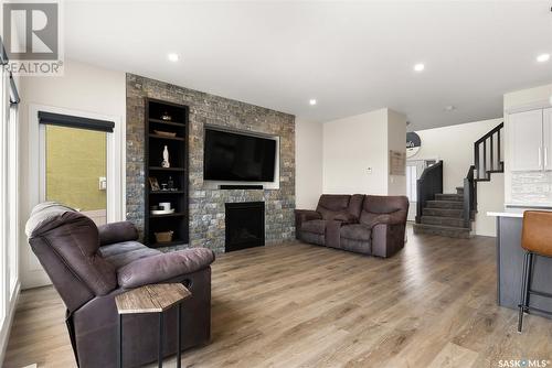 114 Vestor Drive, Pilot Butte, SK - Indoor Photo Showing Living Room With Fireplace