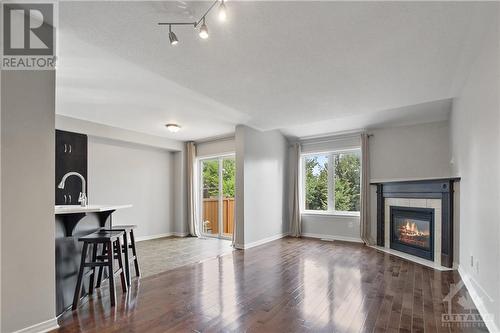 411 Celtic Ridge Crescent, Ottawa, ON - Indoor Photo Showing Living Room With Fireplace