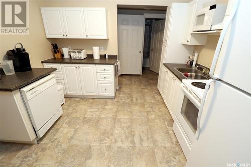 304 1St Street W, Delisle, SK - Indoor Photo Showing Kitchen With Double Sink
