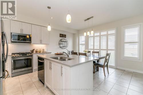 31 Samuel Cres, Springwater, ON - Indoor Photo Showing Kitchen With Stainless Steel Kitchen With Double Sink With Upgraded Kitchen