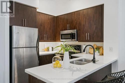 #203 -500 St Clair Ave W, Toronto, ON - Indoor Photo Showing Kitchen With Double Sink With Upgraded Kitchen