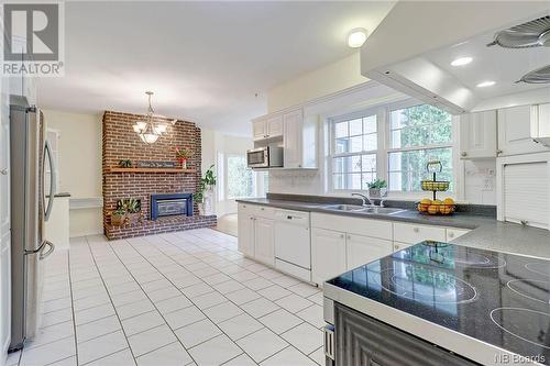 1 Howe Crescent, Oromocto, NB - Indoor Photo Showing Kitchen With Fireplace With Double Sink
