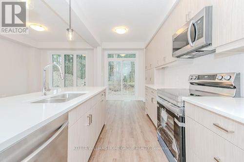 #57 -143 Elgin St N, Cambridge, ON - Indoor Photo Showing Kitchen With Double Sink
