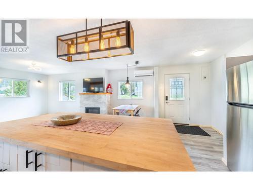 919 Regina Street, Creston, BC - Indoor Photo Showing Kitchen With Fireplace