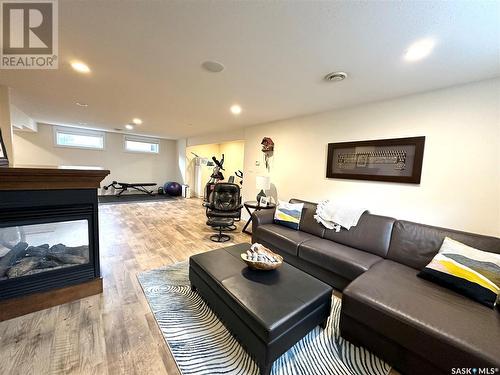 209 Riverbend Place, Battleford, SK - Indoor Photo Showing Living Room With Fireplace