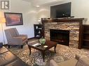 700 Bighorn  Boulevard Unit# 713B, Radium Hot Springs, BC  - Indoor Photo Showing Living Room With Fireplace 