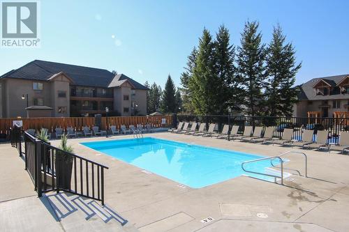 700 Bighorn  Boulevard Unit# 713B, Radium Hot Springs, BC - Outdoor With In Ground Pool With Backyard