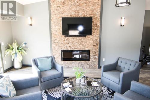 700 Bighorn  Boulevard Unit# 713B, Radium Hot Springs, BC - Indoor Photo Showing Living Room With Fireplace