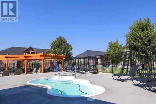 700 Bighorn  Boulevard Unit# 713B, Radium Hot Springs, BC - Outdoor With In Ground Pool With Deck Patio Veranda