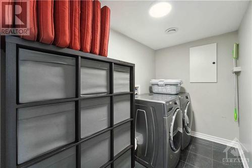 Main level laundry room - 312 Fernleaf Crescent, Ottawa, ON - Indoor Photo Showing Laundry Room