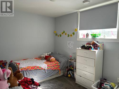 1835 First  Street, Fruitvale, BC - Indoor Photo Showing Bedroom