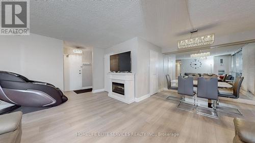 #612 -120 Dundalk Dr, Toronto, ON - Indoor With Fireplace
