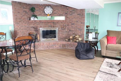 Big recroom with wood fireplace - 119 Jarrett Place, Dunnville, ON - Indoor Photo Showing Living Room With Fireplace