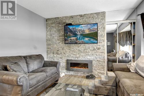 153 Halifax Street, Regina, SK - Indoor Photo Showing Living Room With Fireplace