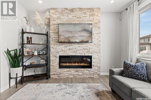 4832 Primrose Green Drive E, Regina, SK - Indoor Photo Showing Living Room With Fireplace