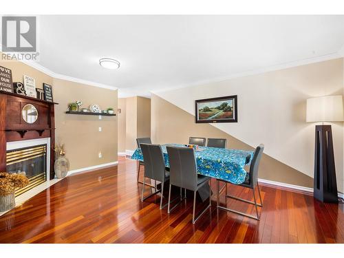 1056 Caledonia Way, West Kelowna, BC - Indoor Photo Showing Dining Room With Fireplace