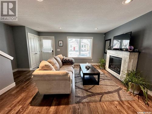 1309 D Avenue N, Saskatoon, SK - Indoor Photo Showing Living Room With Fireplace