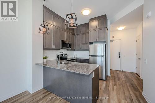#610 -95 Dundas St W, Oakville, ON - Indoor Photo Showing Kitchen With Stainless Steel Kitchen With Upgraded Kitchen