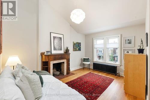 283 Wright Ave, Toronto, ON - Indoor Photo Showing Bedroom With Fireplace