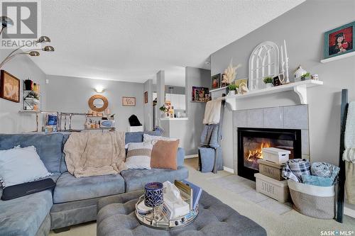 104 Gore Place, Regina, SK - Indoor Photo Showing Living Room With Fireplace