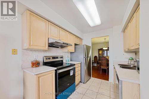 #703 -3088 Kennedy Rd, Toronto, ON - Indoor Photo Showing Kitchen With Stainless Steel Kitchen With Double Sink