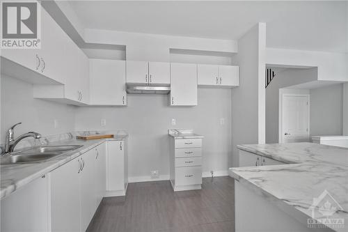 Images provided are to showcase builder finishes - 513 Brigatine Avenue, Ottawa, ON - Indoor Photo Showing Kitchen With Double Sink