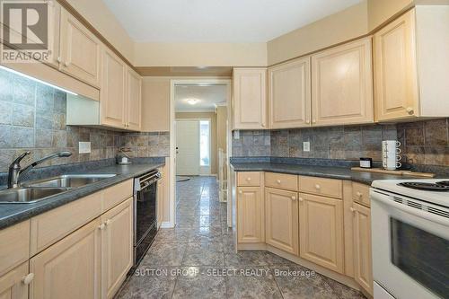 #34 -14 Doon Dr, London, ON - Indoor Photo Showing Kitchen With Double Sink