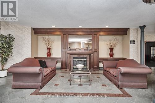 #226 -8111 Forest Glen Dr, Niagara Falls, ON - Indoor Photo Showing Living Room With Fireplace