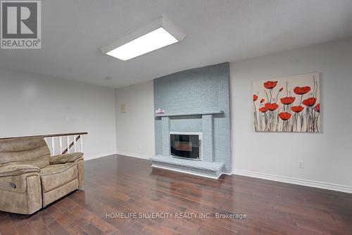 32 Fallen Oak Crt, Brampton, ON - Indoor Photo Showing Living Room With Fireplace