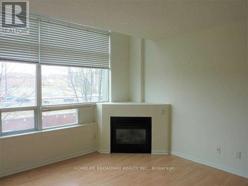 221 - 200 Manitoba Street, Toronto, ON - Indoor Photo Showing Other Room With Fireplace
