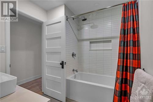 3rd bathroom features a tub and a shower. - 163 Irving Avenue, Ottawa, ON - Indoor Photo Showing Bathroom