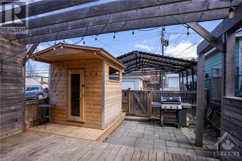Sauna was installed in 2022 by Chinook and an EV car charger was added for the carport. Carport can fit 2 cars. - 163 Irving Avenue, Ottawa, ON - Outdoor With Deck Patio Veranda With Exterior