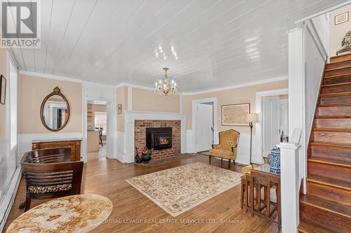 Main - 592 Simmons Road, Loyalist, ON - Indoor Photo Showing Living Room With Fireplace