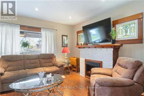 100 Elgin St, Port Colborne, ON - Indoor Photo Showing Living Room With Fireplace