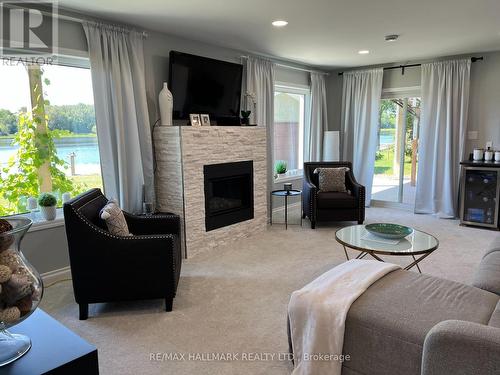 105 Willow Court, Rainy River, ON - Indoor Photo Showing Living Room With Fireplace