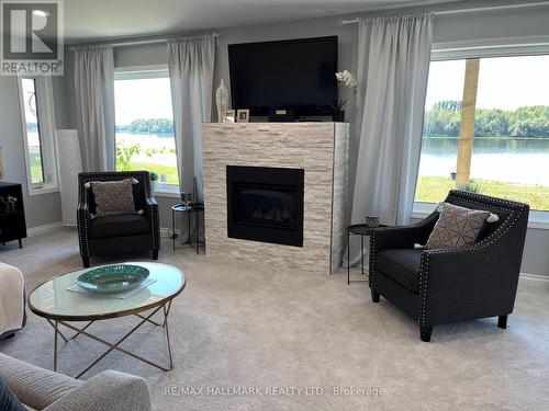 105 Willow Court, Rainy River, ON - Indoor Photo Showing Living Room With Fireplace