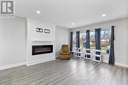 3135 Academy Drive, Windsor, ON - Indoor Photo Showing Living Room With Fireplace