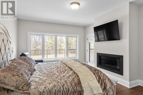 56 Georgian Grande Drive, Oro-Medonte, ON - Indoor Photo Showing Bedroom With Fireplace