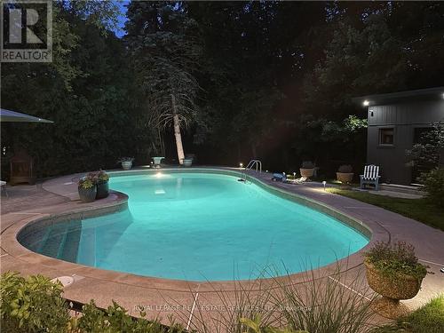1910 Kerns Rd, Burlington, ON - Outdoor With In Ground Pool With Backyard