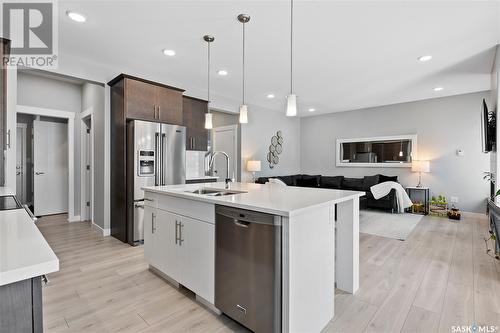 3244 Crosbie Crescent, Regina, SK - Indoor Photo Showing Kitchen With Stainless Steel Kitchen With Double Sink With Upgraded Kitchen