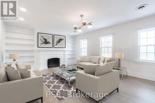 25 Coulson Ave, Toronto, ON - Indoor Photo Showing Living Room With Fireplace