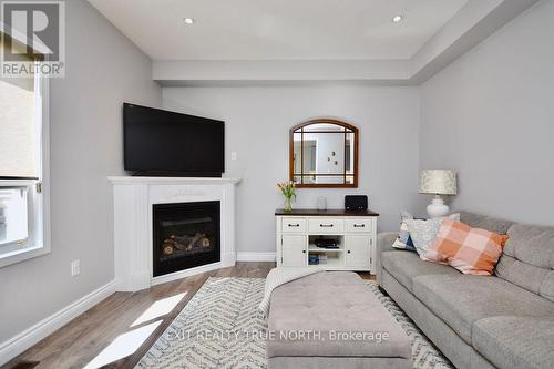 93 Monarchy St, Barrie, ON - Indoor Photo Showing Living Room With Fireplace