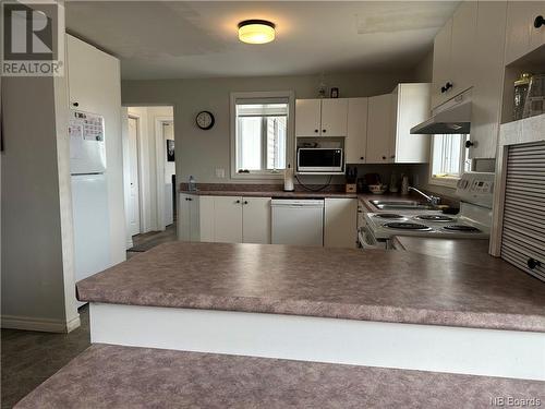 229 Rue  Emile, Beresford, NB - Indoor Photo Showing Kitchen With Double Sink